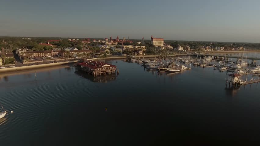 Aerial of St. Augustine Florida over inlet bridge and marina at sunrise