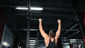 Gymnast hand on horizontal bar in the gym.