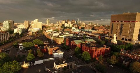 Epic aerial view of Cambridge and Boston Skyline during summer sunset