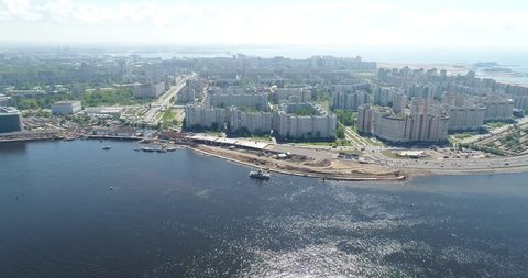 Aerial view. Big City. Bay. Sunny day. Ships crossing one by one. Saint-Petersburg, Russia