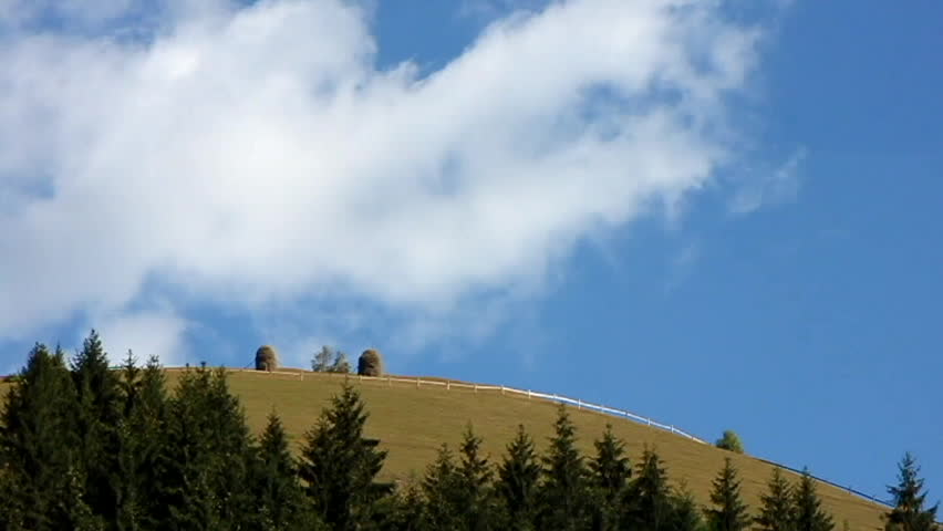 clouds flying over the meadow in summer