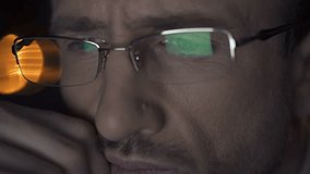 Busy male reading information on computer, working overtime, night shift - Powered by Shutterstock - Get 15% off with code: PIKWIZARD15