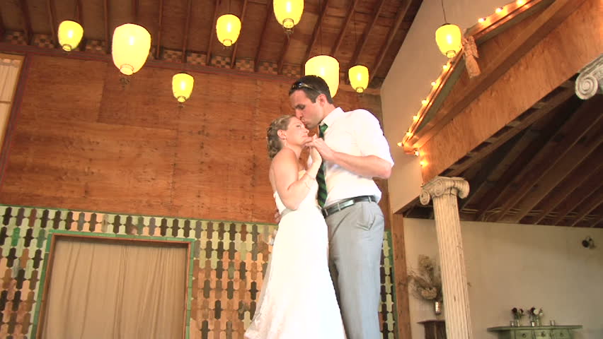 Model released bride and groom share their first dance together on their wedding