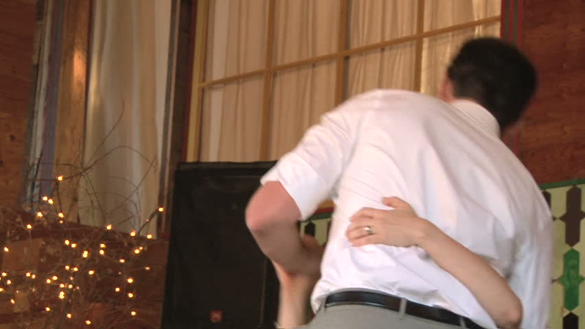 Model released bride and groom share their first dance together on their wedding
