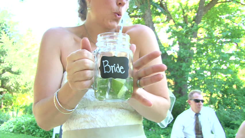 Model released bride with her bride beverage on her wedding day.