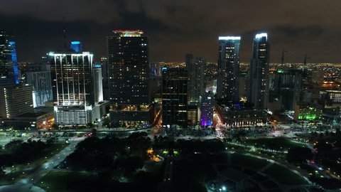 MIAMI, FL, USA - JUNE 11, 2017: Aerial flyby Downtown Miami at night drone 4k 24p prores