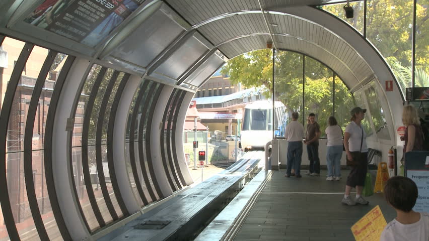 SYDNEY, AUSTRALIA, MAR 22, 2009: A Monorail Train arrives a station and people
