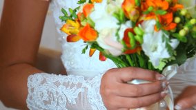 wedding flowers in bride`s hands
