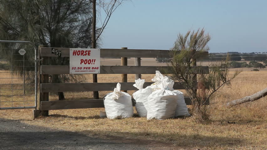 Horse poo for sale at a fence in Australia