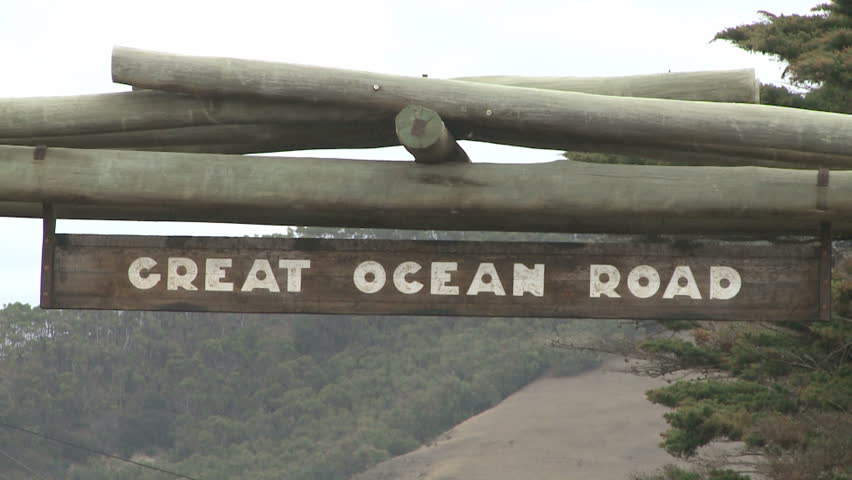 Great ocean road highway signs with cars passing near South ocean in Australia,