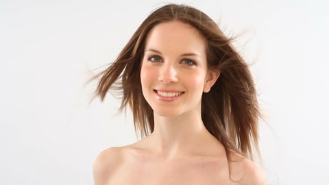 Beautiful young woman with windy hair; Full HD Photo JPEG
