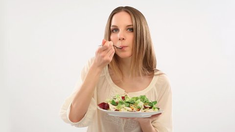 Beautiful young woman eating salad; Full HD Photo JPEG
