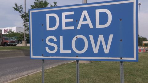 Woodstock, Ontario, Canada June 2017 Speed limit sign off highway telling drivers to go dead slow