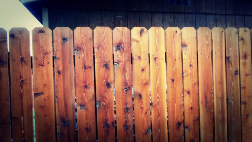 A camera stabilizer shot of a wooden fence