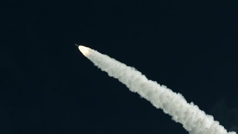 Space rocket launch from Kennedy Space Center, Florida in super slow motion - dark sky and smoke