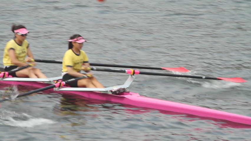 HONG KONG - NOVEMBER 5: Close-up of  woman rowing in racing contest slow motion