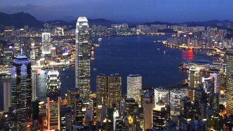 Time lapse of Blue Night in Hong Kong (panning) - Central District, Victoria Harbor, Hong Kong Island and Kowloon, Hong Kong.