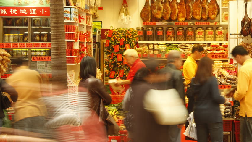 HONG KONG - FEBRUARY 8: Time lapse of people walking through Chinese food store