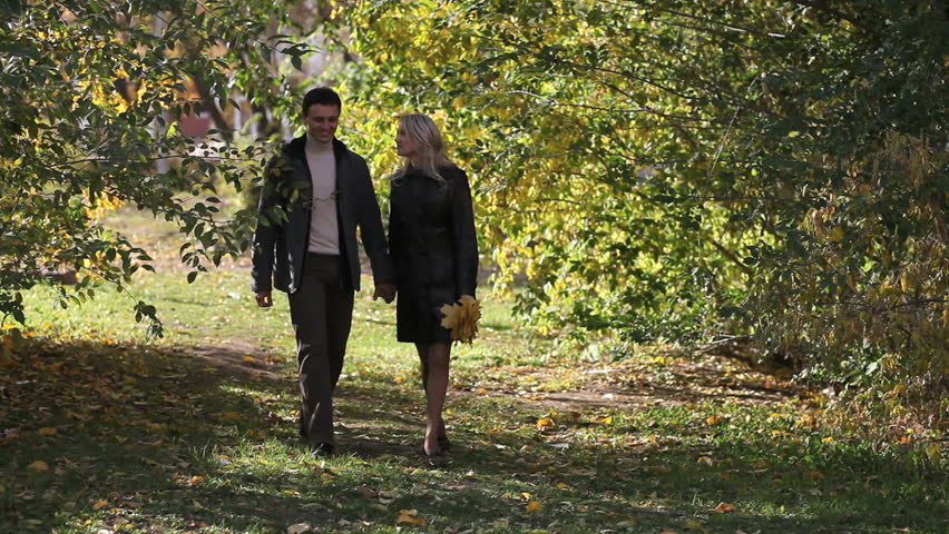 Couple Walking Unhurriedly Through Autumn Park Stock Footage Video 100 Royalty Free 2777642