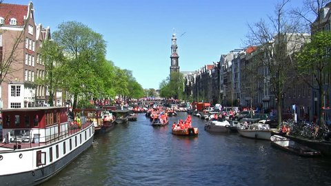 AMSTERDAM - APR 30, 2012: City natives celebrate Queen's Day on the Amsterdam canals., Dutch annual national holiday,  Amsterdam, The Netherlands