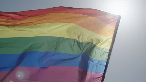 Slow motion shot of the pride flag waving in the wind