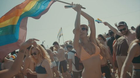 TEL AVIV, ISRAEL - June 9th 2017. Sexy woman holding the pride flag during the pride parade in the city