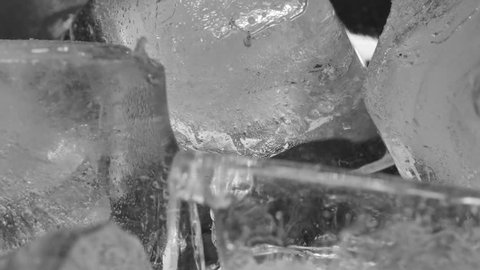 Ice cubes melting and dissolve, Macro time lapse shot