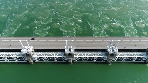 Aerial top-down view of Oosterscheldekering is the largest of the 13 ambitious Delta Works series of dams and storm surge barriers designed to protect the Netherlands from flooding from the North Sea