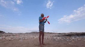 Juggler using juggling pins to practice at the beach in Sicily - Slow motion video 