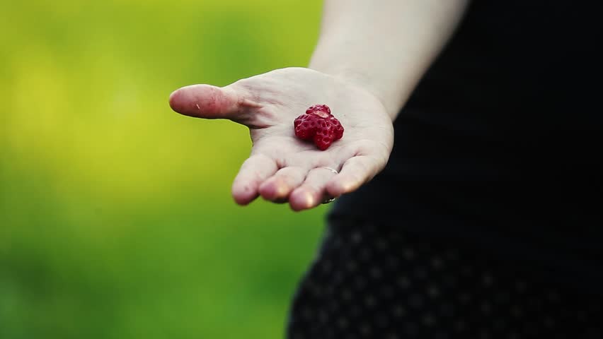 Woman holding a star shaped strawberry