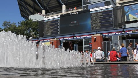 FLUSHING, NEW YORK - SEPT 1: US Open Tennis fans gather around fountains outside Arthur Ashe Stadium on September 1, 2012 in Flushing, NY.