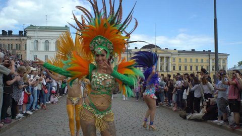 HELSINKI, FINLAND - JUNE 10, 2017: Women in carnival costumes dance on the streets of the city during the Helsinki Samba Carnaval 2017.