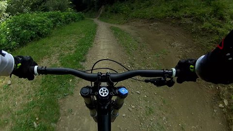 DoDownhill front view. Ride a bike over terrain pov. 