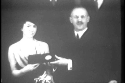 Jane Morrow Lindbergh is awarded the Hubbard Medal by the National Geographic Society in honor of her role as co-pilot to her husband Charles Lindbergh during the aerial surveys he conducted