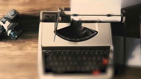 Typing a film script or a book on a vintage typewriter