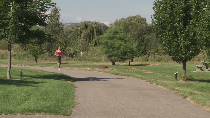 Young woman on a fitness run in the park