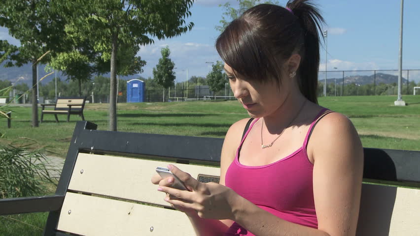 Young woman texting on a cell phone