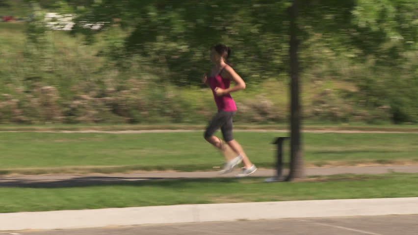 Young woman on a fitness run in the park