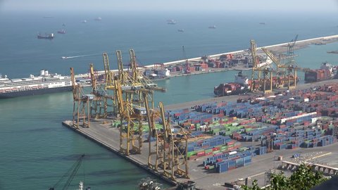 BARCELONA - SPAIN, APRIL 6, 2015, 4K Aerial view of busy industrial port, crane machine load container