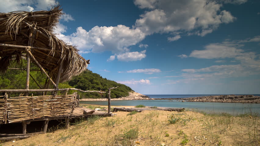 timelapse of a wooden shack on beautiful limoni beach in mljet island, croatia with stunning crystal clear water of the adriatic sea.