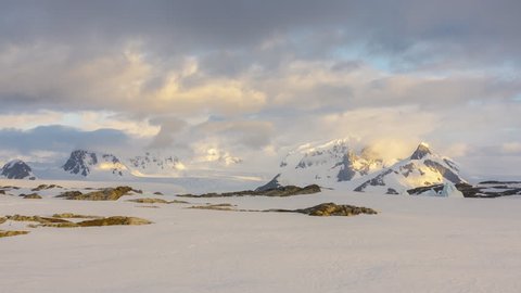 Time lapse sunset in Antarctica. Mountains and alpine glow.