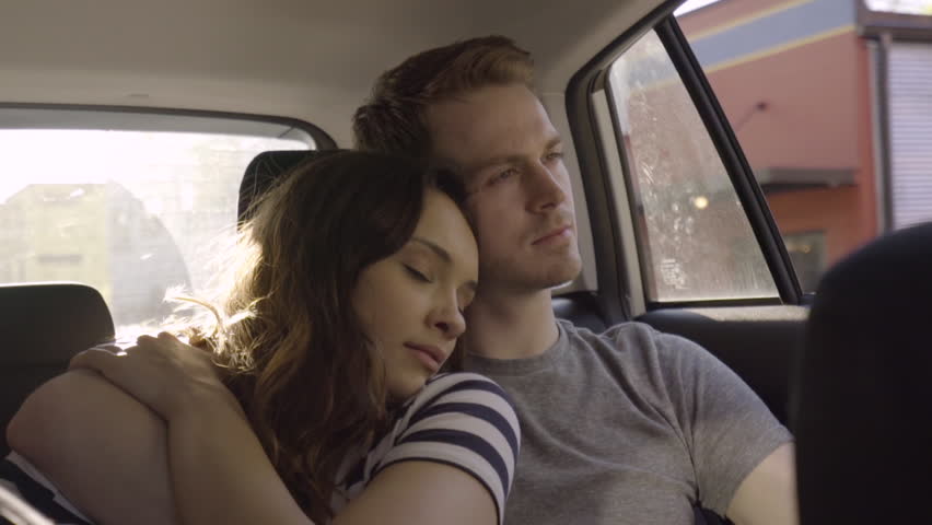 Cute Couple Cuddle And Kiss In Back Seat Of Moving Car (Slow Motion) Royalty-Free Stock Footage #27834250