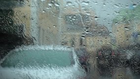 Rain drop on the windshield on the day of rain. FullHD video