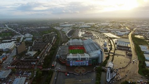 UK, MANCHESTER - APRIL 16, 2017: Old Trafford is a football stadium Greater Manchester, England, and the home of Manchester United. Aerial View Flying Over Iconic Football Ground in 4K Ultra HD