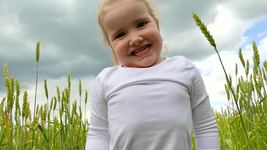 Little girl playing wheat field | Shutterstock HD Video #27852475