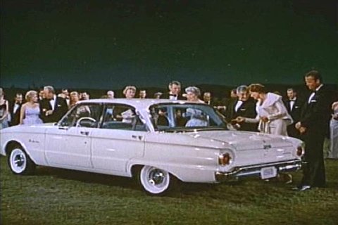 1960s: Three new models of Fords are shown to party guests, backed by a choir in 1960.