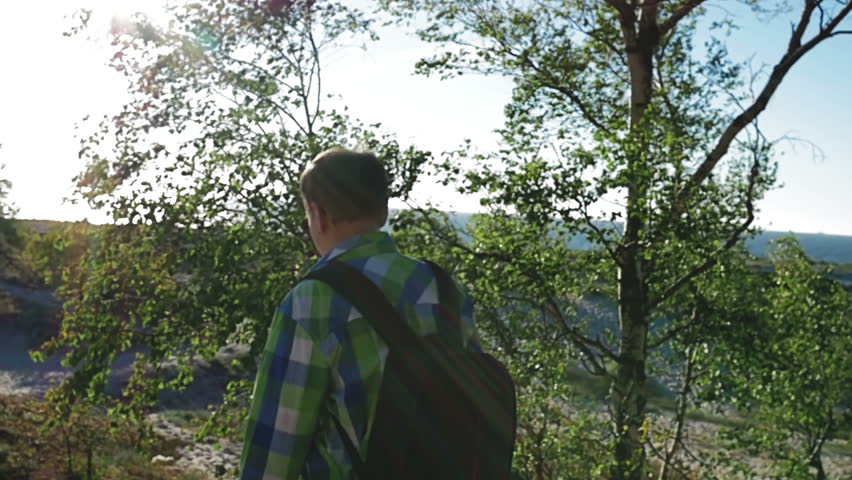 Slow motion, Defocus, Photographer is walking along dunes to sea