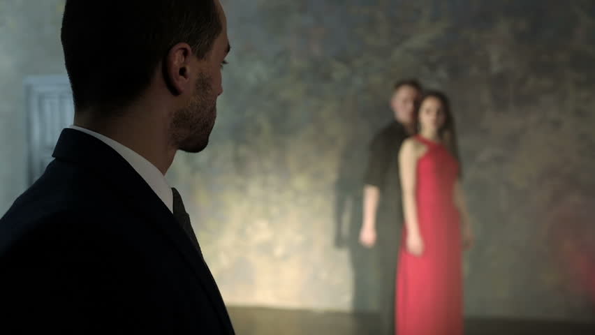 A rich man looks at a couple dancing tango. Love and dancing. Retro studio. Slow motion.
