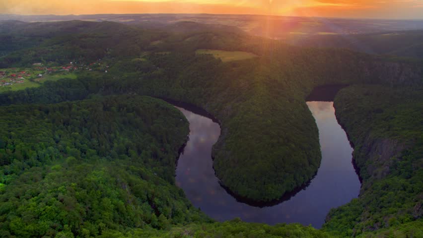 River canyon with dark water and summer colorful forest. Horseshoe bend, Vltava river, Czech republic. Beautiful landscape with river. Maj lookout.