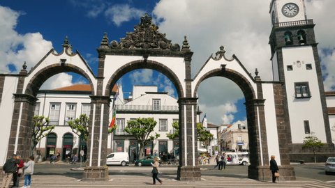 AZORES, May 2017 - POV gimbal shot of the Portas da Cidade - City Gates - in Ponta Delgada, Sao Miguel, The Azores, Portugal on a sunny day.